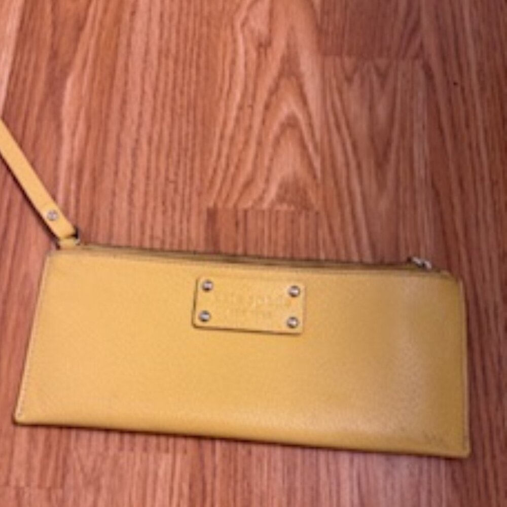 Kate Spade yellow gold wristlet.